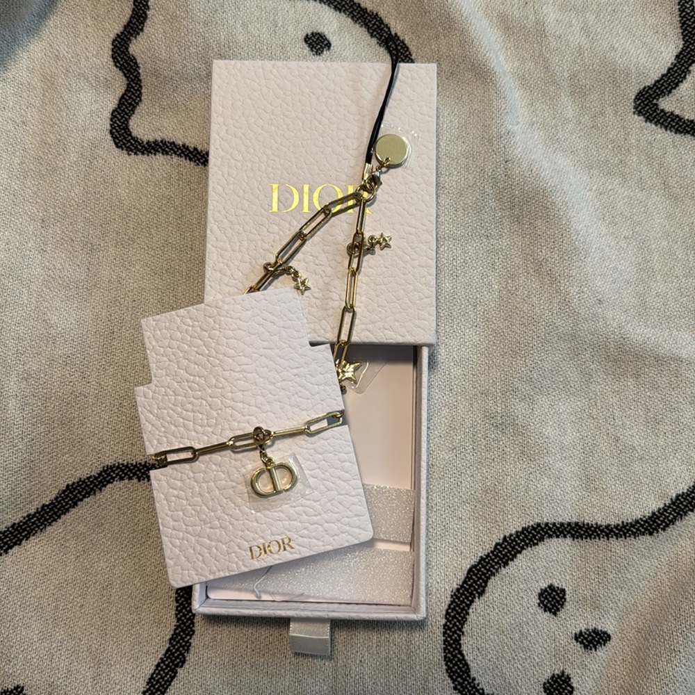 Dior gold tone metal charm cell phone strap! Great gift idea one size fits all